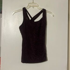 Lucy purple/black workout top. Self shelf bra. Criss-cross strap back.